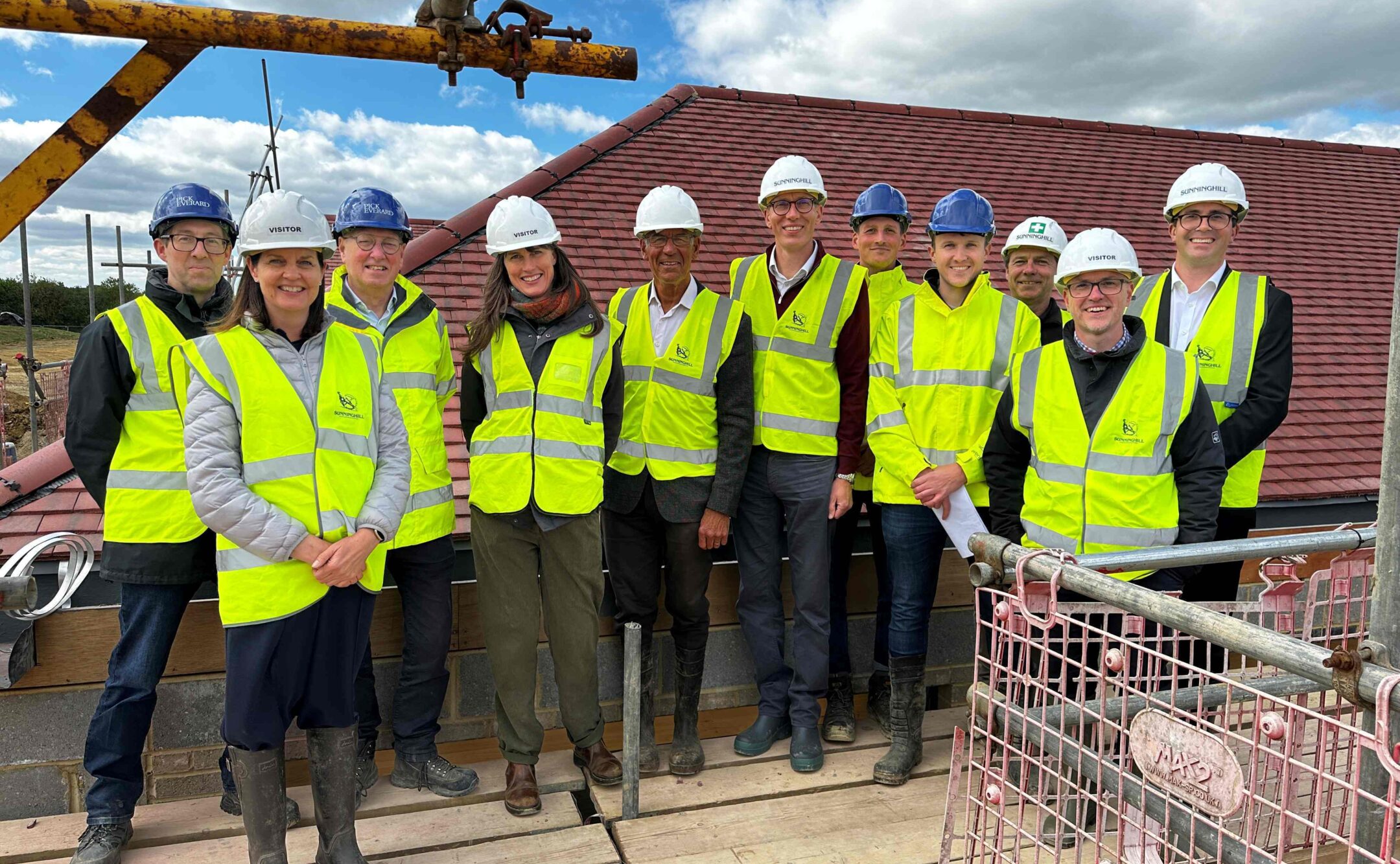 Project team standing together on top of scaffolding at Wealden Community Sports Hub